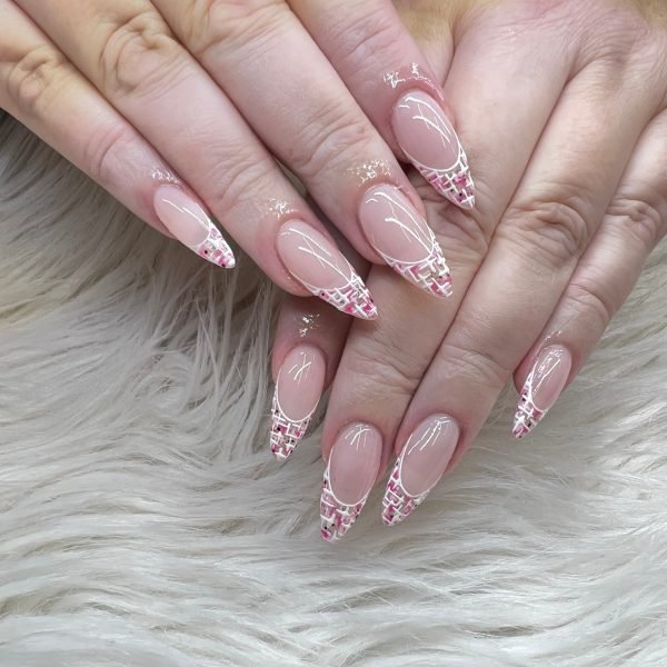 Woman hand with long nails manicure and light pink nail polish tweed design